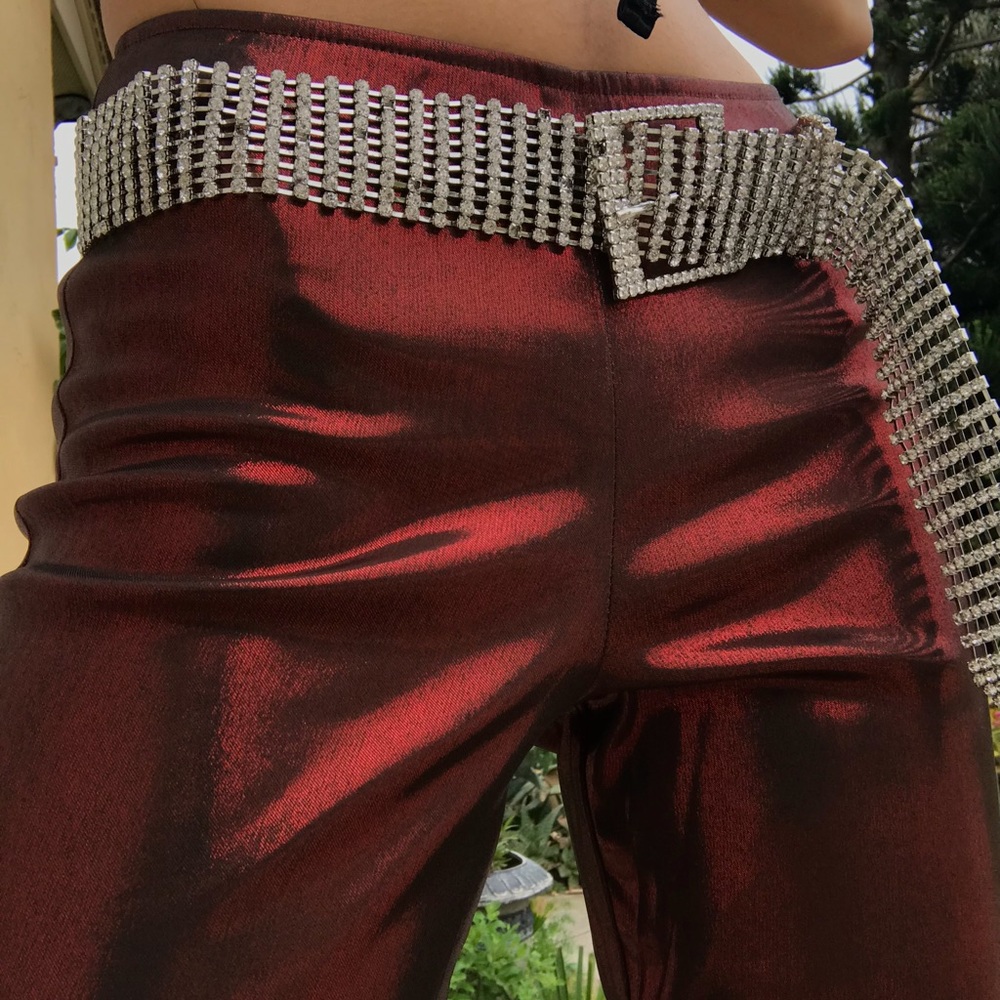 Red/rust colored disco shiny flare pants